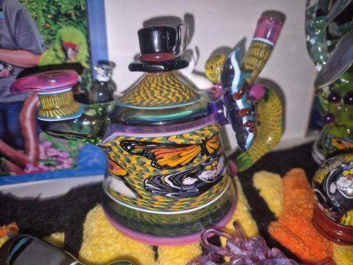Colourful, decorative teapot with intricate patterns and a whimsical design.